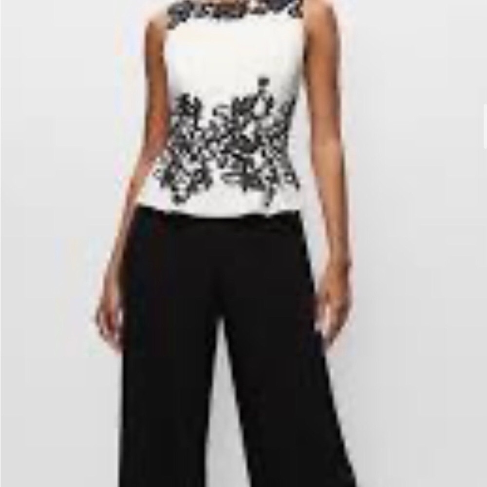 Melanie Lyne Peplum style wide leg jumpsuit. Size 6 tags on